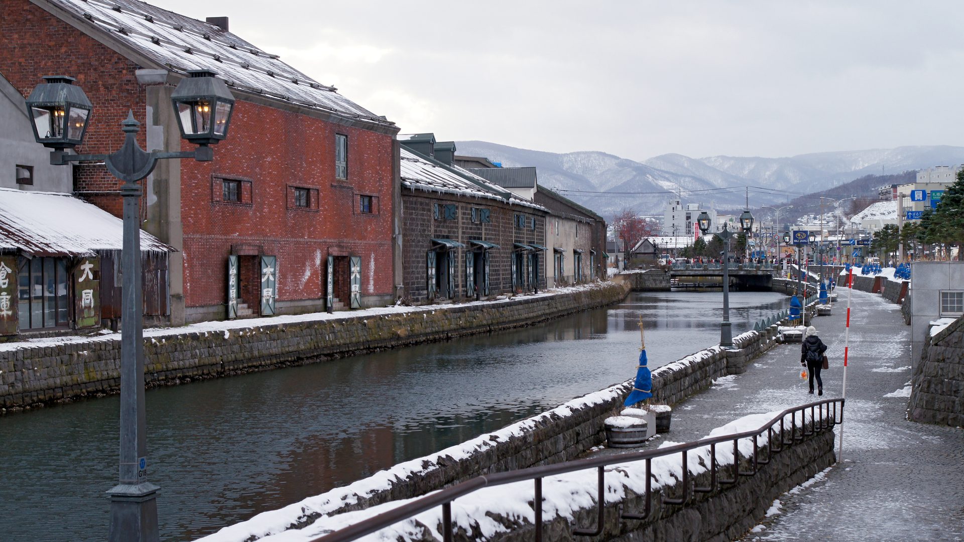 Historic Otaru Canal and stone warehouses under snow in Hokkaido, Japan