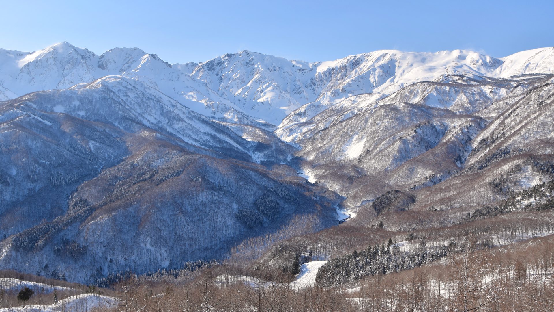 Snow-covered Northern Japanese Alps above Hakuba Valley in Nagano, Japan